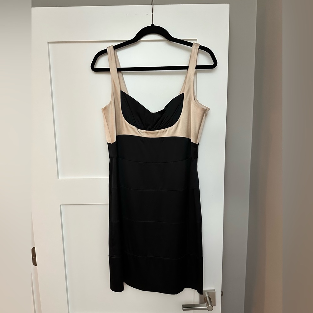 Sleek BCBG minidress, Size 12. Rouch at bust and tiered fabric in dress.